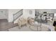 Open-concept living area with staircase, comfortable seating, and modern decor, blending style and functionality at 1043 20Th Avenue Se Loop, Hickory, NC 28602