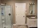 Bathroom with glass shower and granite vanity at 110 Indian Harbor Cir, Mount Gilead, NC 27306