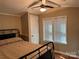 Bedroom featuring hardwood floors, a ceiling fan, and ample natural light at 110 Indian Harbor Cir, Mount Gilead, NC 27306