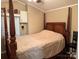Bedroom with wooden furniture and hardwood floors at 110 Indian Harbor Cir, Mount Gilead, NC 27306