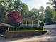 Charming single-story home with a welcoming front porch and meticulously landscaped front yard at 110 Indian Harbor Cir, Mount Gilead, NC 27306
