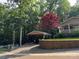 Beautiful home exterior with carport and a beautiful red tree in a landscaped yard at 110 Indian Harbor Cir, Mount Gilead, NC 27306