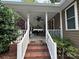 Covered front porch with ample seating at 110 Indian Harbor Cir, Mount Gilead, NC 27306