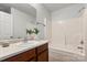 Bathroom featuring a vanity with a sink and faucet with a bathtub/shower in the background at 1125 Kurt Ct, Charlotte, NC 28209