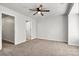 A bright bedroom with neutral walls and carpet, featuring access to an adjacent bathroom at 1125 Kurt Ct, Charlotte, NC 28209