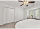 Bedroom featuring carpet, white walls, a ceiling fan, and two large closets at 1125 Kurt Ct, Charlotte, NC 28209