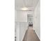 Upstairs hallway with carpet, neutral paint, and an open view to a bedroom at 1125 Kurt Ct, Charlotte, NC 28209