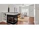 Inviting living room showcasing a fireplace, hardwood floors, and a ceiling fan at 1125 Kurt Ct, Charlotte, NC 28209