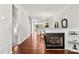 Living room with hardwood floors, open to the dining area and filled with natural light at 1125 Kurt Ct, Charlotte, NC 28209
