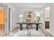 Office featuring a desk, chair, rug and natural lighting from the glass doors at 1125 Kurt Ct, Charlotte, NC 28209