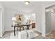 Office featuring a desk, chair, rug and natural lighting from the glass doors at 1125 Kurt Ct, Charlotte, NC 28209