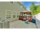 Home exterior showcasing a cozy patio and backyard deck with a brown gazebo at 11538 Ardrey Crest Dr, Charlotte, NC 28277
