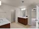 Spacious bathroom with double vanity, ceramic tile floors, and lots of natural light at 11538 Ardrey Crest Dr, Charlotte, NC 28277