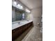 Bathroom features double sinks, tiled floors, a large mirror and a glass enclosed shower for comfort and convenience at 11538 Ardrey Crest Dr, Charlotte, NC 28277