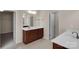 Bathroom with double vanity, large mirror, and access to bedroom and closet at 11538 Ardrey Crest Dr, Charlotte, NC 28277