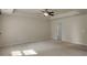 This bedroom includes neutral carpet, a ceiling fan, and is freshly painted in neutral colors at 11538 Ardrey Crest Dr, Charlotte, NC 28277