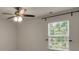 Bedroom featuring a ceiling fan, window with blinds, and neutral paint at 11538 Ardrey Crest Dr, Charlotte, NC 28277