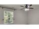 Bright, clean bedroom features a window, blinds, and a ceiling fan at 11538 Ardrey Crest Dr, Charlotte, NC 28277