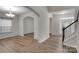 Dining Room showcasing wainscoting, chandelier, and LVP floors at 11538 Ardrey Crest Dr, Charlotte, NC 28277