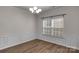 Dining room featuring decorative wainscoting, chandelier, and a window at 11538 Ardrey Crest Dr, Charlotte, NC 28277