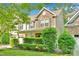 Well-maintained two-story home with manicured landscaping and a cozy front porch at 11538 Ardrey Crest Dr, Charlotte, NC 28277