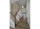 Bright foyer with hardwood floors, staircase, and arched doorways showcasing an open floor plan at 11538 Ardrey Crest Dr, Charlotte, NC 28277