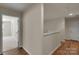 Upper-level hallway with wood floors and neutral walls leading to the bedrooms at 11538 Ardrey Crest Dr, Charlotte, NC 28277
