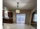 Bright kitchen with tile flooring, stainless steel sink, and sliding door at 11538 Ardrey Crest Dr, Charlotte, NC 28277