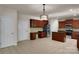 Spacious kitchen features tile floors, stainless steel appliances, kitchen island, and ample cabinet space at 11538 Ardrey Crest Dr, Charlotte, NC 28277