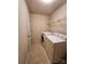 Bright laundry room equipped with modern washer, dryer, and shelving, provides functionality for laundry tasks at 11538 Ardrey Crest Dr, Charlotte, NC 28277