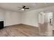 Open living room featuring LVP flooring, fireplace, and archway to entry at 11538 Ardrey Crest Dr, Charlotte, NC 28277