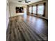 Open-concept living room featuring hardwood floors, many windows with nice curtains at 11538 Ardrey Crest Dr, Charlotte, NC 28277