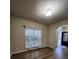 Bright living room with hardwood floors, large window, and neutral paint colors at 11538 Ardrey Crest Dr, Charlotte, NC 28277