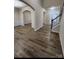 Spacious living room featuring hardwood floors, an archway, and a staircase at 11538 Ardrey Crest Dr, Charlotte, NC 28277