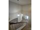 A high-angle shot shows the staircase with hardwood railing, leading to a view of the foyer and front door at 11538 Ardrey Crest Dr, Charlotte, NC 28277
