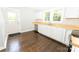 Modern kitchen featuring stainless steel appliances, butcher block countertops, and white cabinets at 1208 Martin Luther King Ave, Kannapolis, NC 28083