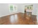 Bright living room featuring beautiful hardwood floors and open view of the Kitchen at 1208 Martin Luther King Ave, Kannapolis, NC 28083
