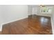 Spacious living room featuring beautiful hardwood floors and a view of the front door at 1208 Martin Luther King Ave, Kannapolis, NC 28083
