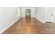 Bright living room featuring beautiful hardwood floors and open view of the Kitchen at 1208 Martin Luther King Ave, Kannapolis, NC 28083