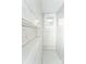 Close-up of renovated walk-in shower featuring elegant subway tile, hexagon floor, and built-in shelving at 1208 Martin Luther King Ave, Kannapolis, NC 28083