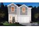 Charming two-story home with gray siding, white trim, and a spacious two-car garage at 125 Johns Cardinal Dr, Mooresville, NC 28115