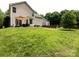 Large backyard with a patio, perfect for outdoor entertaining and relaxation at 12928 Windy Lea Ln, Huntersville, NC 28078