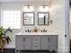 Modern bathroom with double vanity, sleek fixtures, and ample lighting for a clean and stylish look at 12928 Windy Lea Ln, Huntersville, NC 28078