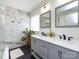Bright bathroom featuring a double vanity, marble shower, and contemporary fixtures for a luxurious feel at 12928 Windy Lea Ln, Huntersville, NC 28078