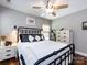 Comfortable bedroom with hardwood floors, a ceiling fan, and natural light creating a relaxing atmosphere at 12928 Windy Lea Ln, Huntersville, NC 28078
