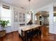 Dining room with hardwood floors, chandelier, and wall décor at 12928 Windy Lea Ln, Huntersville, NC 28078
