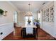 Bright dining area with hardwood floors, large picture window, and natural light at 12928 Windy Lea Ln, Huntersville, NC 28078