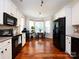 Bright kitchen featuring stainless steel appliances, white cabinetry, and breakfast nook at 12928 Windy Lea Ln, Huntersville, NC 28078