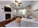 Cozy living room featuring a fireplace, hardwood floors, and neutral decor for relaxing at 12928 Windy Lea Ln, Huntersville, NC 28078