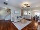 Spacious living room with hardwood floors and neutral decor creates a cozy atmosphere at 12928 Windy Lea Ln, Huntersville, NC 28078